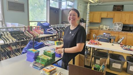 Stuff the Bus volunteer sorts supplies