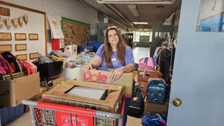 Stuff the Bus volunteer sorts supplies