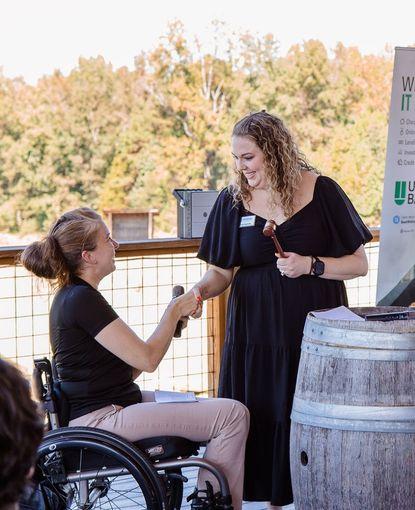 Current Chair Michelle Barnhart passes the gavel to incoming Chair Lauren Heavner